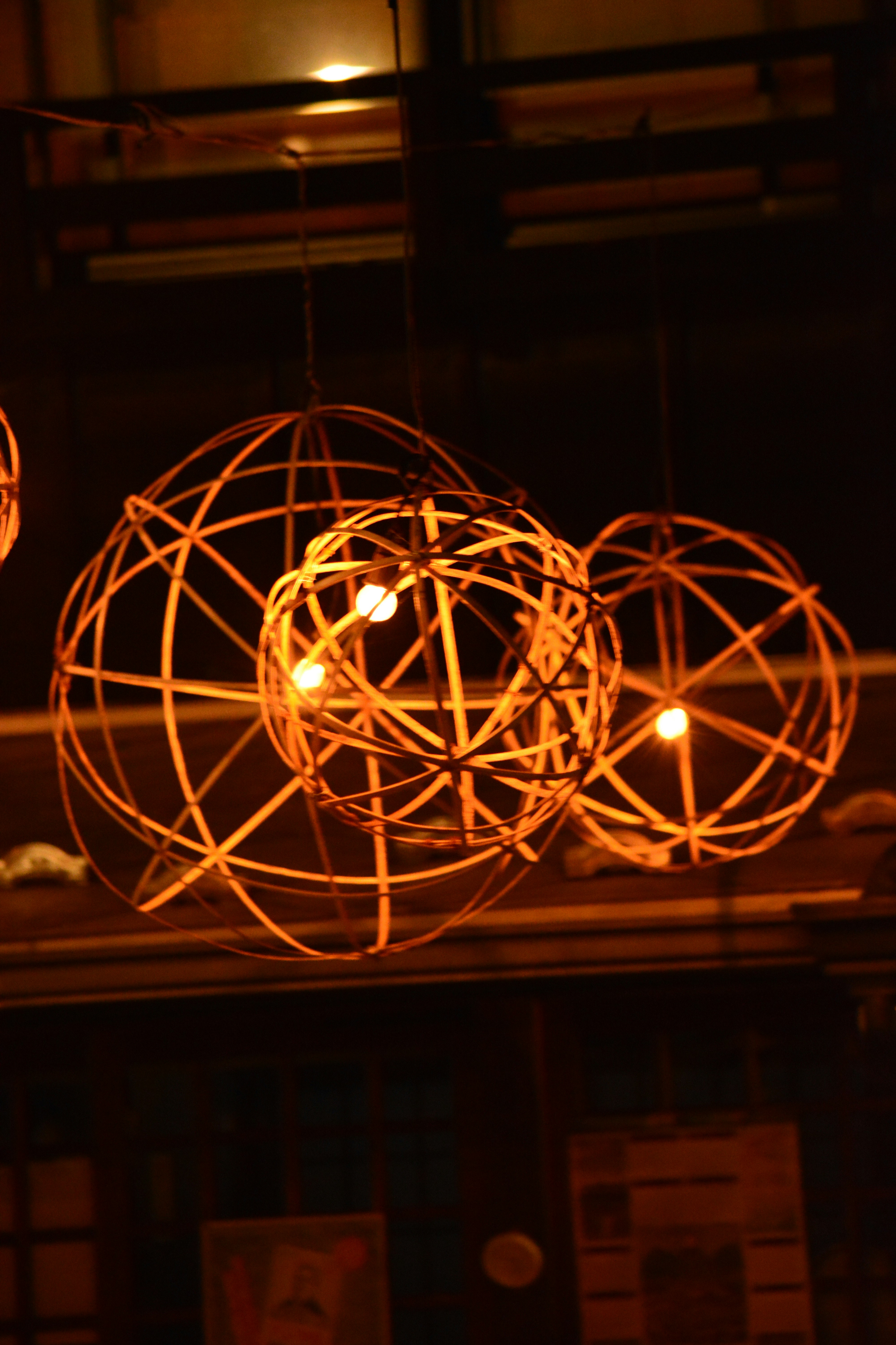 glowing string sphere light fixture in an indoor room