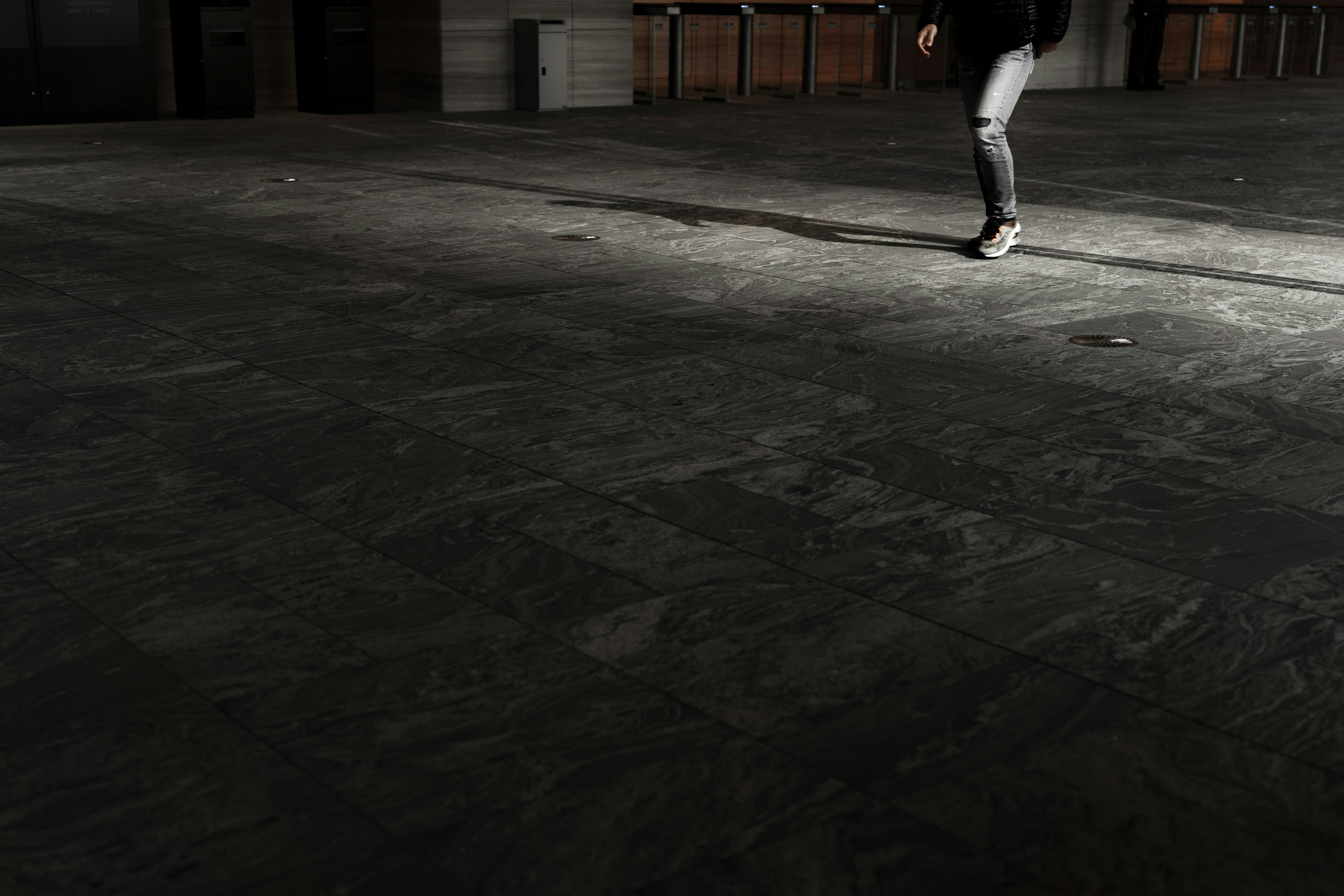 nighttime outdoor running shoes and pavement shadows