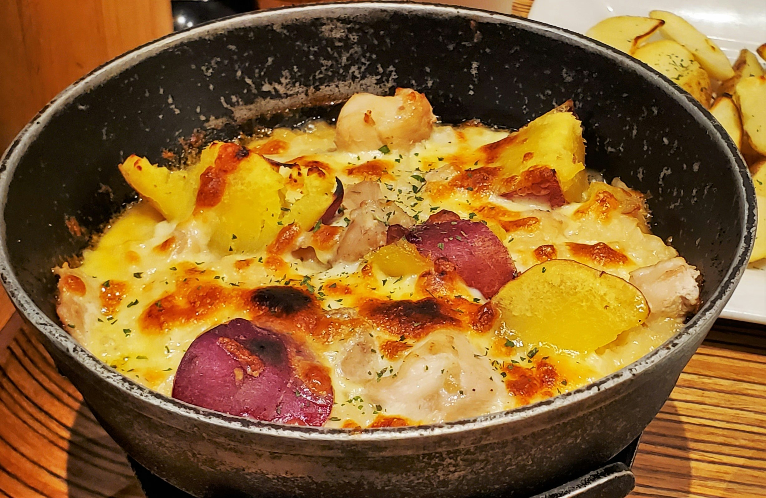 Cheese and vegetable omelet-style dish in a skillet