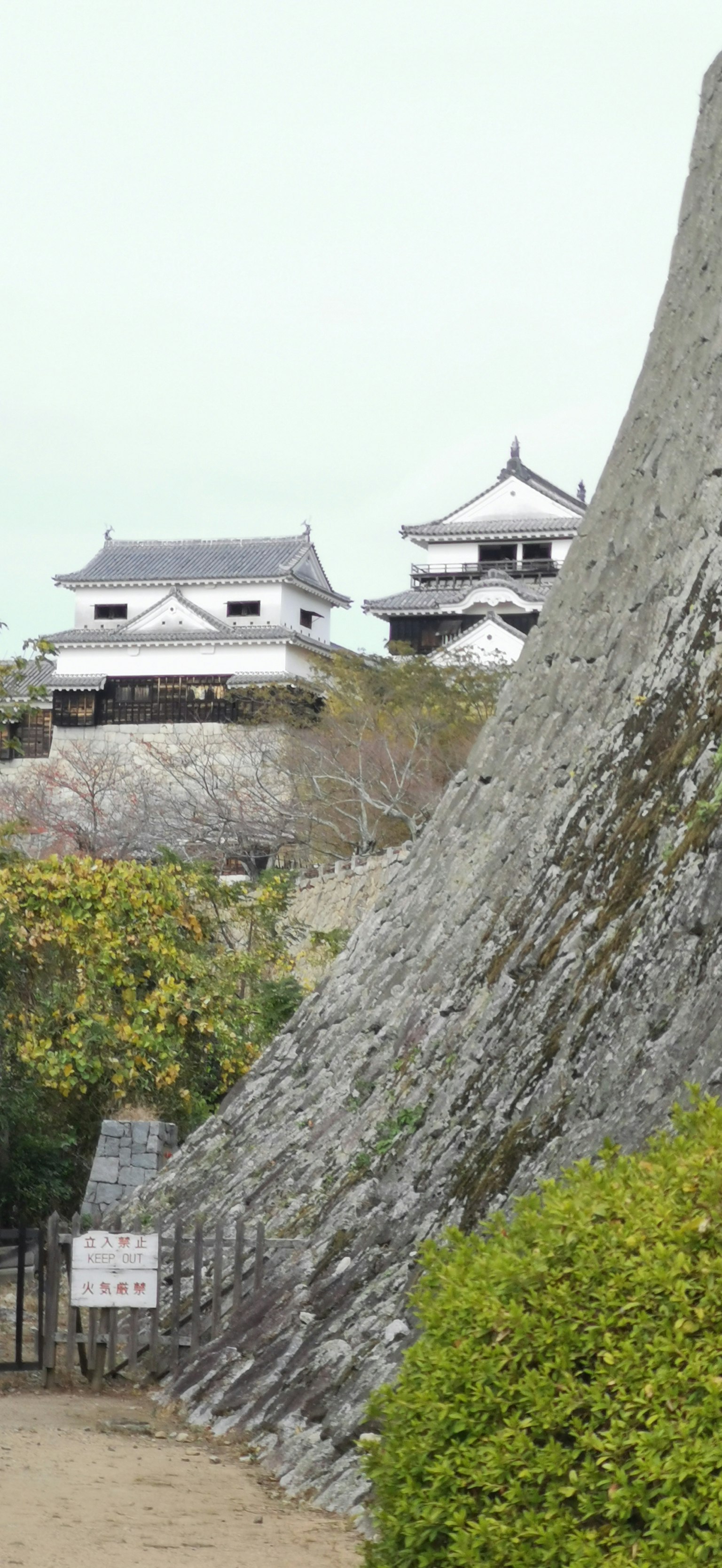 View of stone walls and castle in the background
