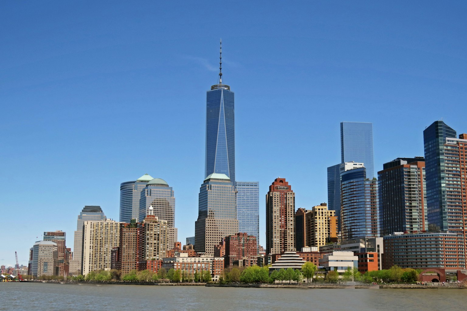 One World Trade Center towering in the Manhattan skyline with surrounding skyscrapers
