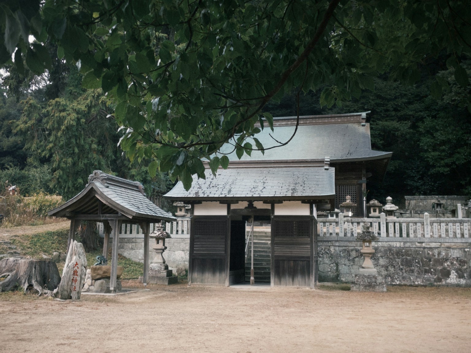 Scenic view of an old shrine gate and building