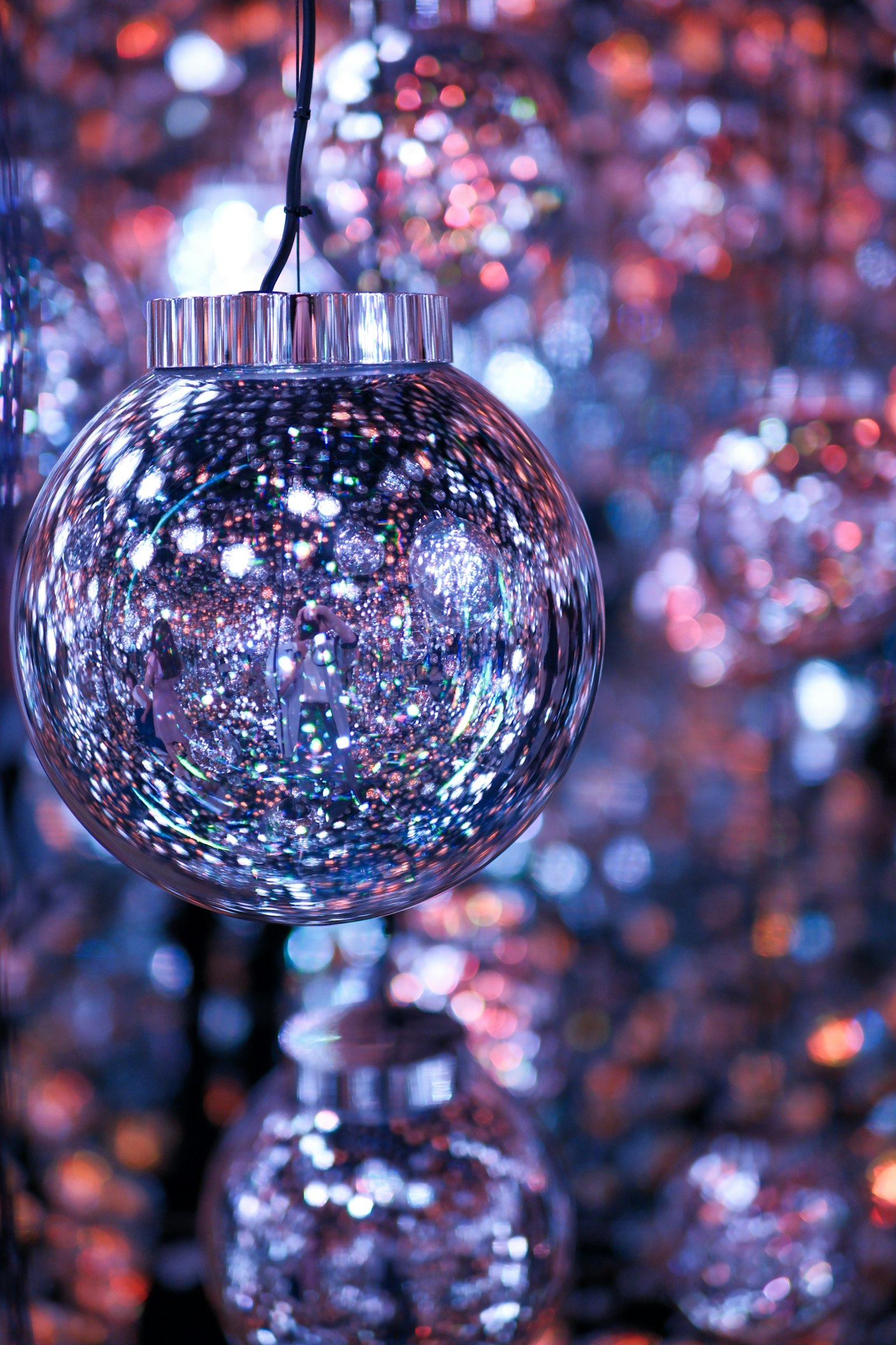 Close-up image of a disco ball reflecting colorful lights