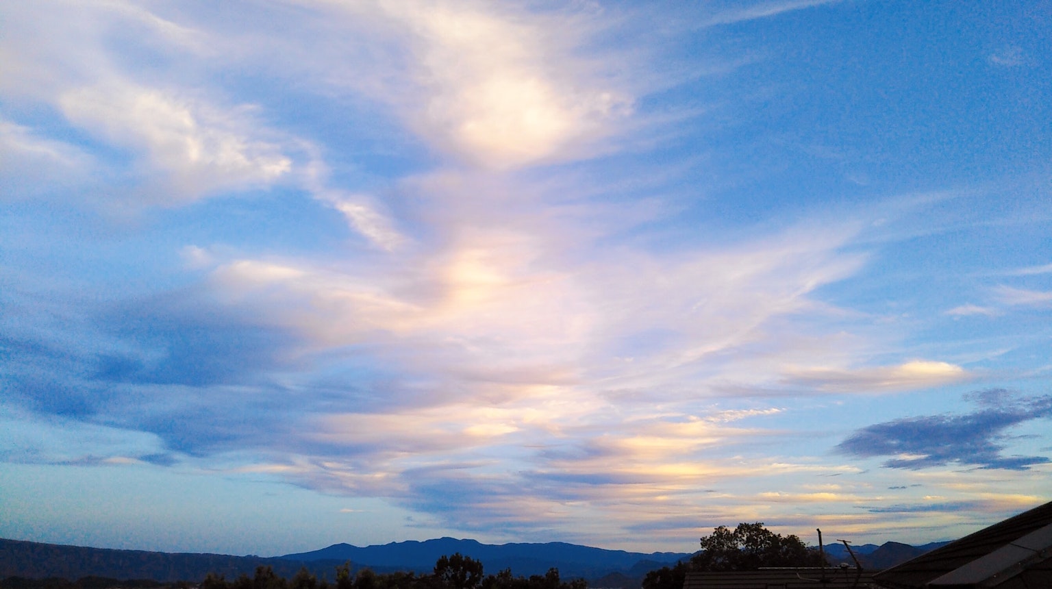 Beautiful landscape with wispy clouds in a blue sky
