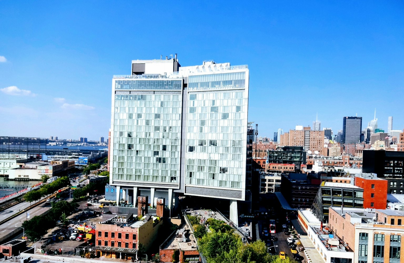 Modern building with glass facade under a clear blue sky